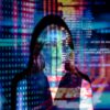 woman with digital code and data projections on skin and clothing in multicolored light