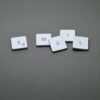 White plastic keyboard keys spelling 'EMAIL' on a grey surface